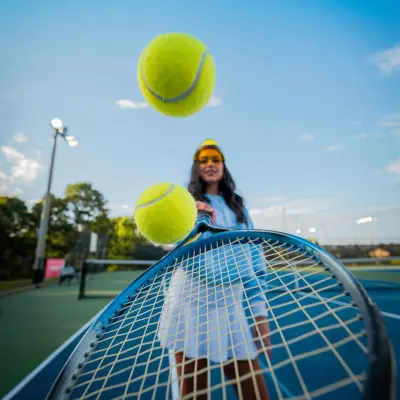 tennis balls bouncing on racket