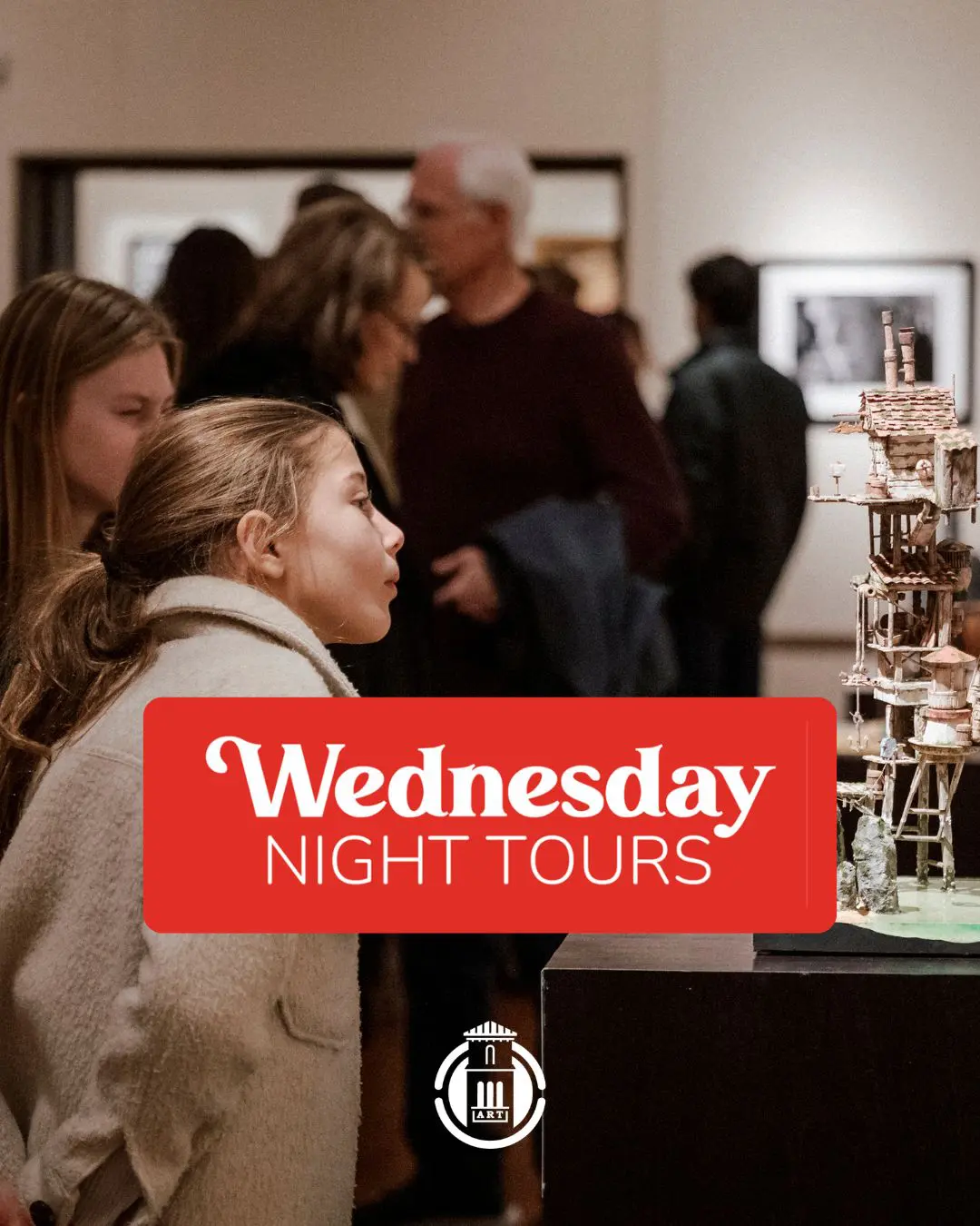 Visitors viewing artwork during Wednesday Night Tours.